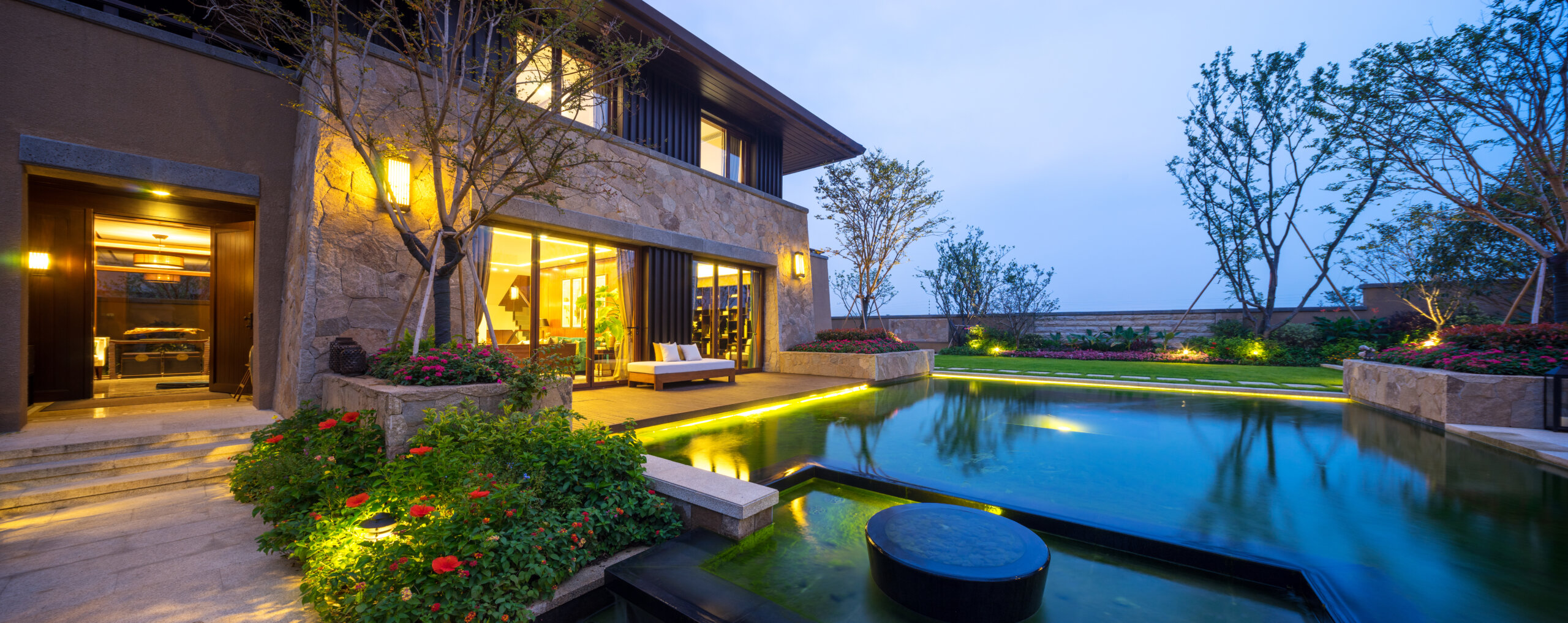 landscape of modern building near pond at dusk