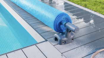 Rolling the pool cover up when opening your pool for summer
