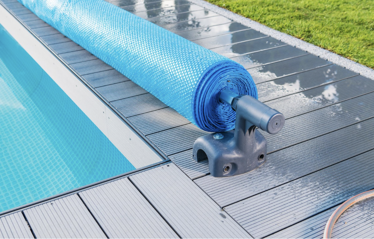 Rolling the pool cover up when opening your pool for summer