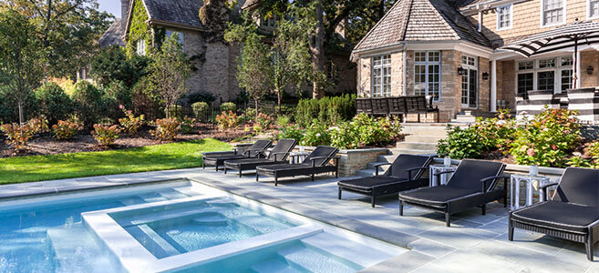 relaxed atmosphere of this poolscape extends the inground pool space