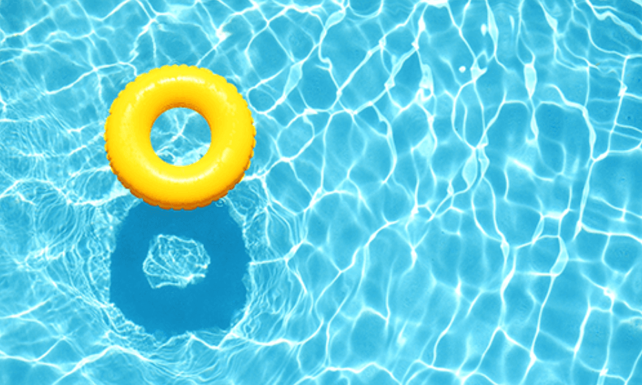 Round yellow pool float in a pool on a sunny day
