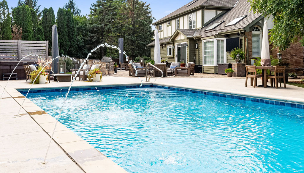 Family-friendly inground pool with ample patio space, highlighting Sunset Pools & Spas' flexible pool financing plans.
